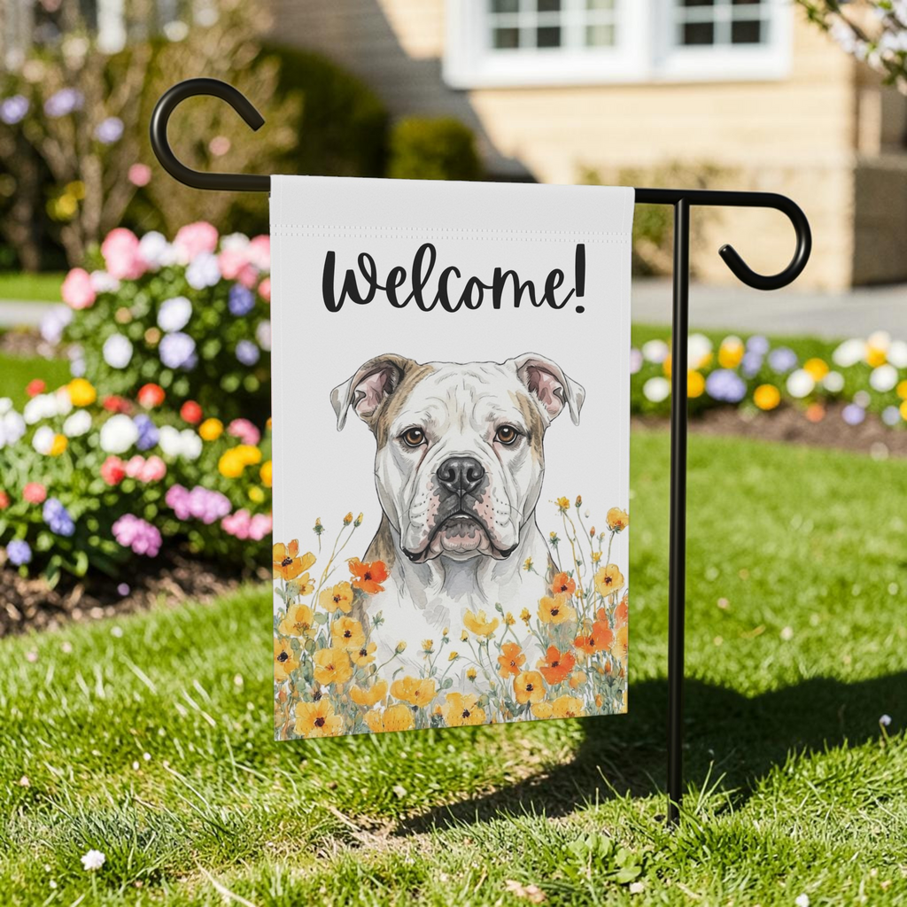 Yellow Poppies American Bulldog Welcome garden flag on a black stand in a front yard with a colorful flower bed and green lawn