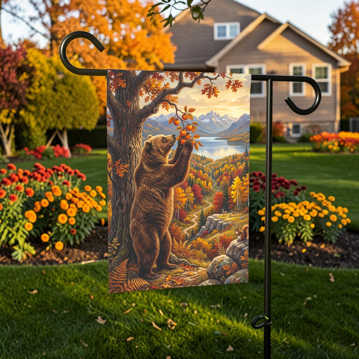 Fruit Tree And Bear garden flag displayed on a stand in an outdoor garden setting
