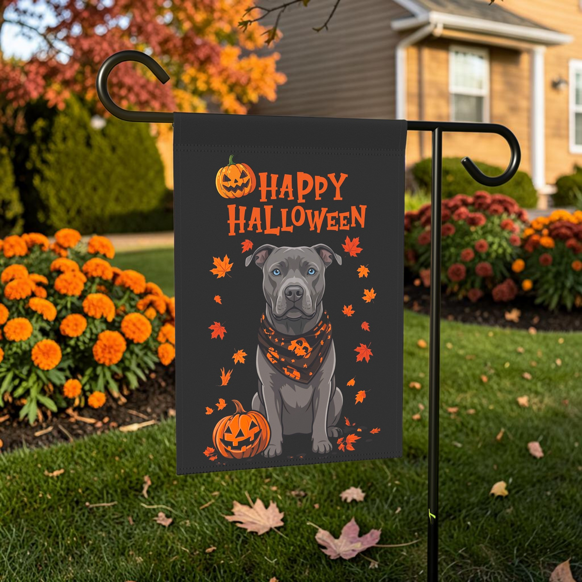 Little Pumpkin And Gray American Pitbull Terrier Happy Halloween Garden Flag shown on a stand near a walkway with seasonal decorations