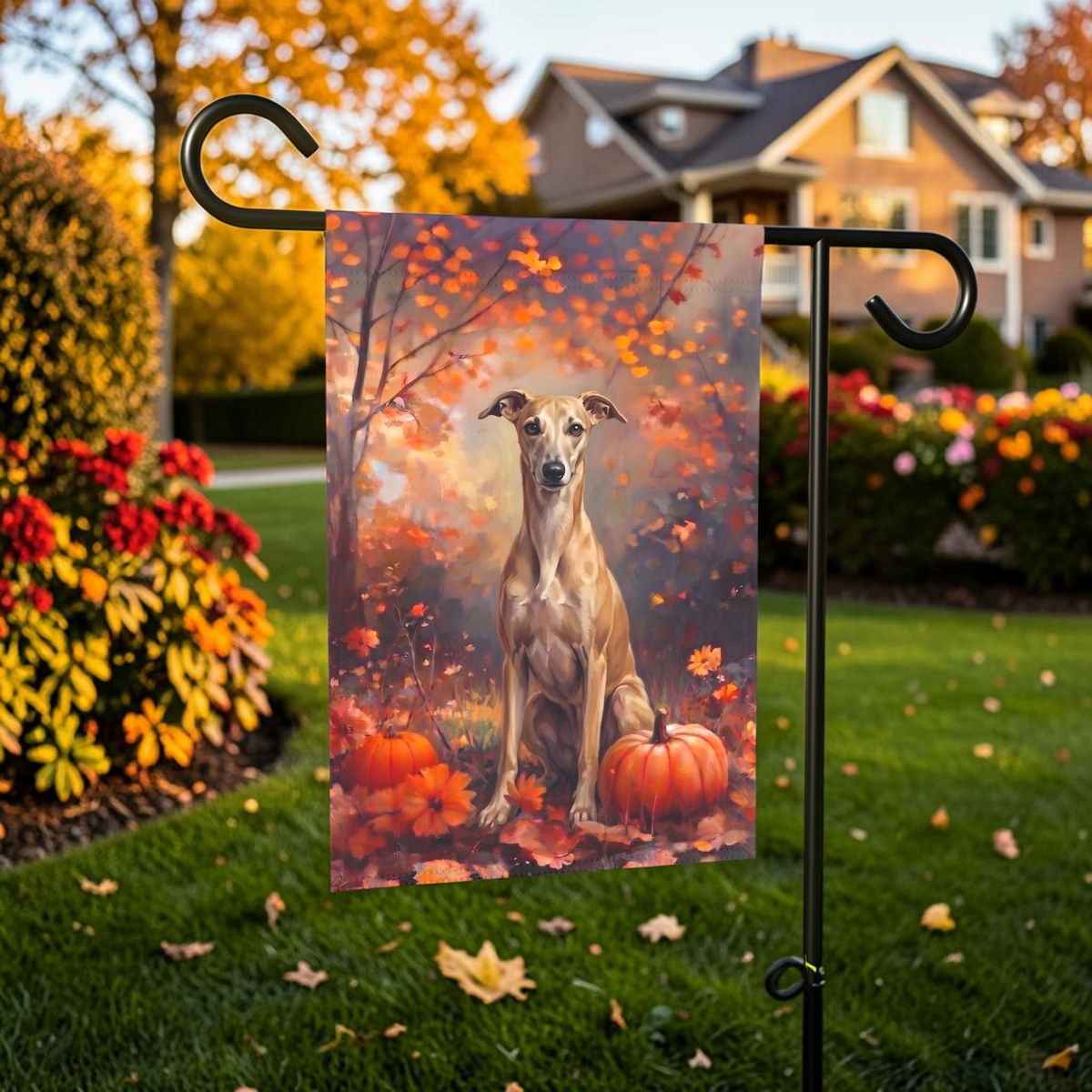 Fall Whippet With Pumpkins on a garden flag stand in front of a house with autumn landscaping