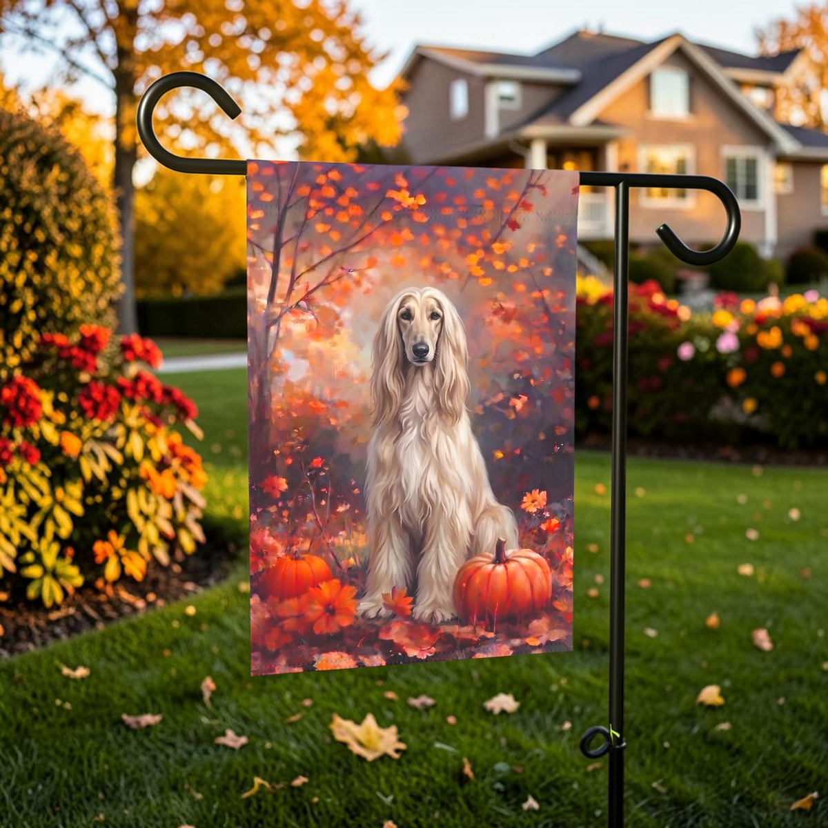 Fall Afghan Hound With Pumpkins on a garden flag stand in front of a house with autumn landscaping