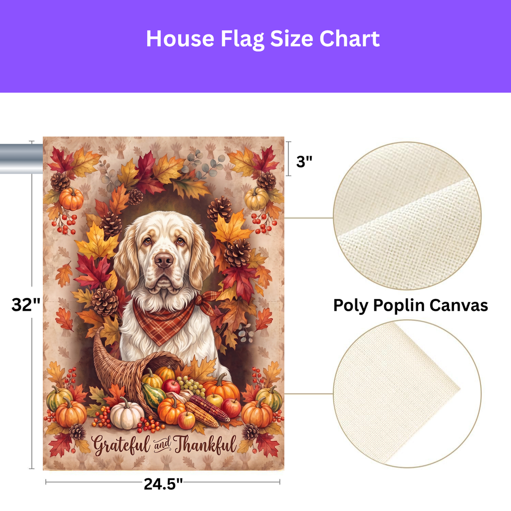Grateful and Thankful Clumber Spaniel garden flag on a stand in a garden bed with orange marigolds and purple flowers