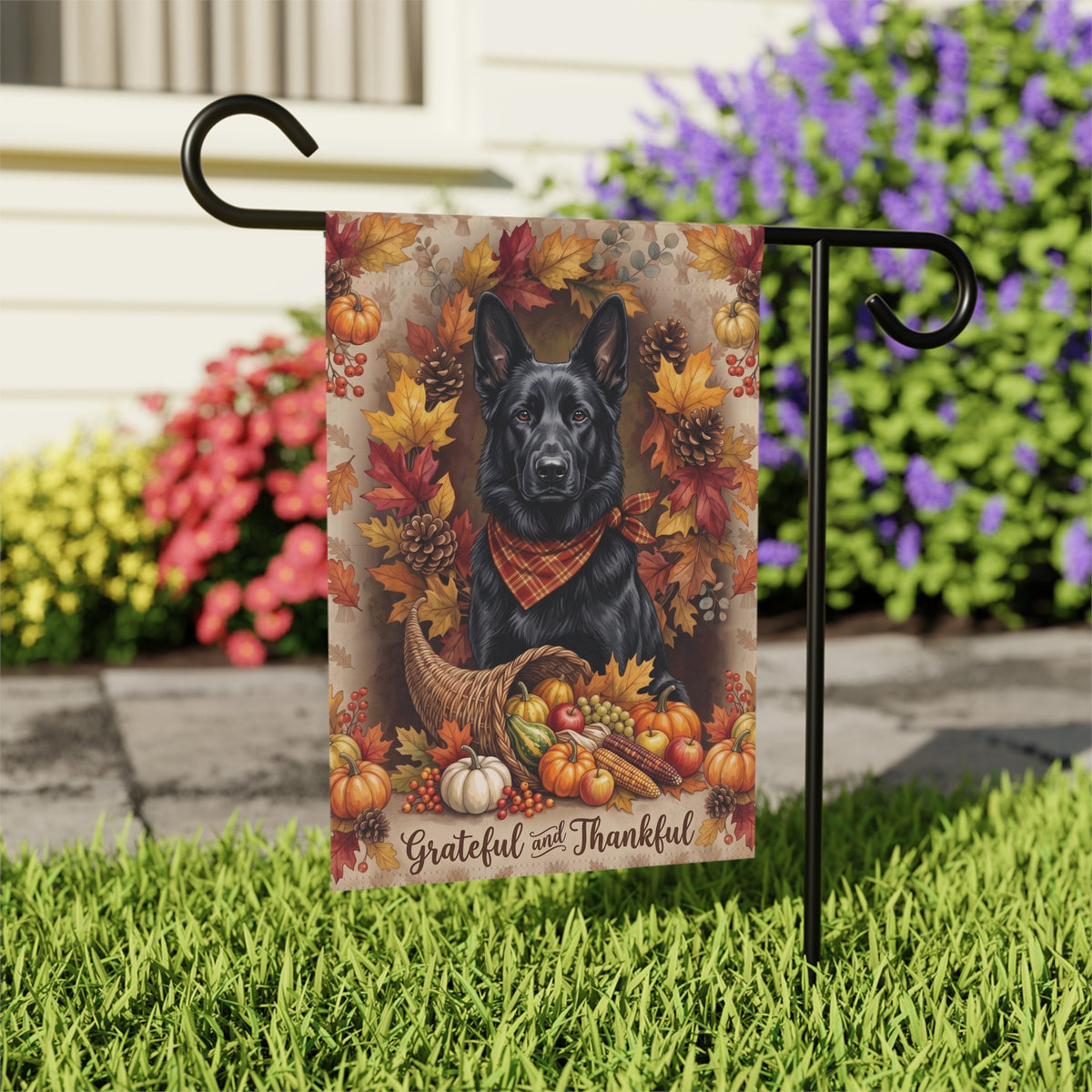 Grateful and Thankful Black German Shepherd house flag mounted on a wall bracket at a diagonal angle against a house exterior