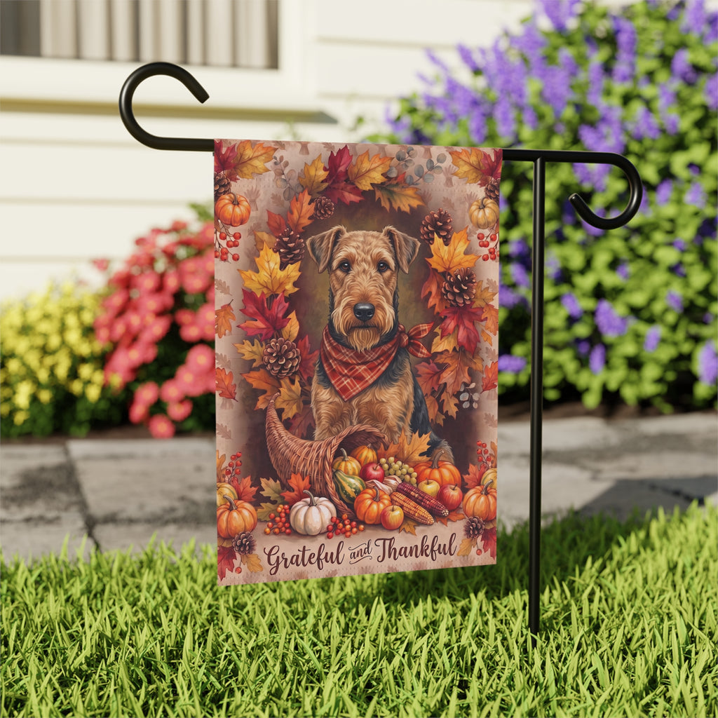 Grateful And Thankful Airedale Terrier house flag mounted on a wall bracket at a diagonal angle against a house exterior