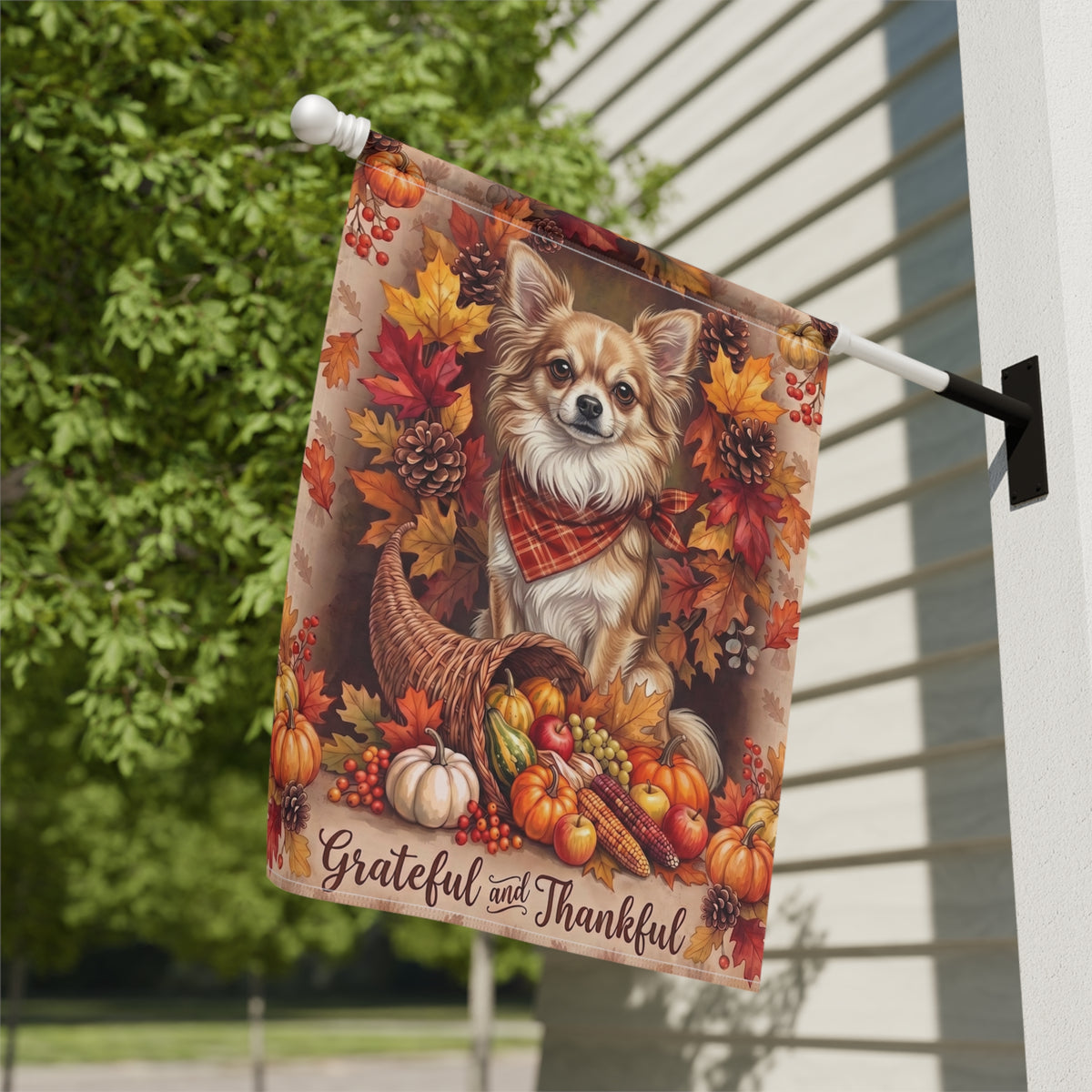 Grateful and Thankful Long Hair Chihuahua house flag mounted on a wall bracket at a diagonal angle against a house exterior